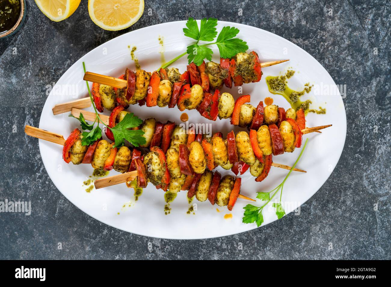 Crispy potato gnocchi skewers grilled with red peppers and chorizo