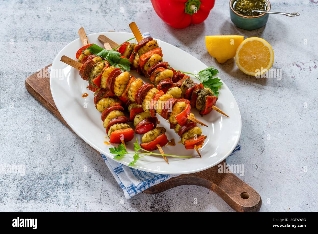 Crispy potato gnocchi skewers grilled with red peppers and chorizo