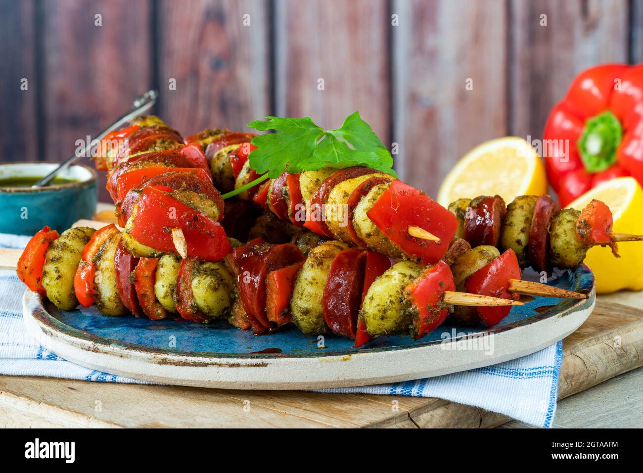 Crispy potato gnocchi skewers grilled with red peppers and chorizo