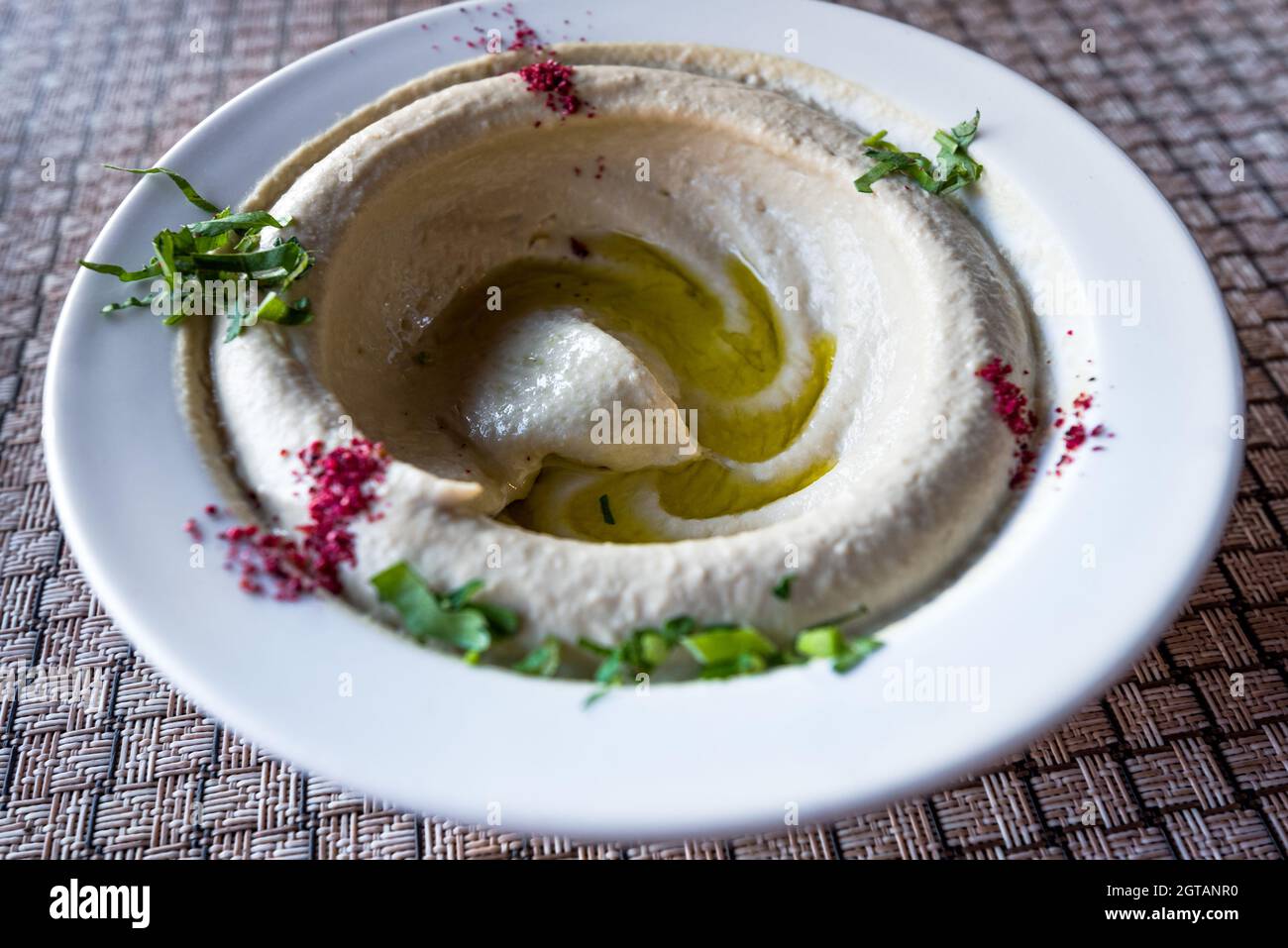 Hummus, Humus on a dish, traditional starter in Middle East. Wadi Musa, Petra in Jordan, jordanian local cuisine. Stock Photo