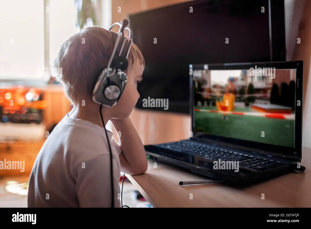 A Boy Watching Hot News About Closed Sport Ground Playground Via Internet The Screen Stock Photo - Alamy