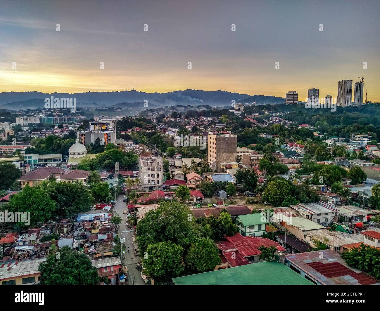 High Angle View Of Townscape Against Sky At Sunset Stock Photo