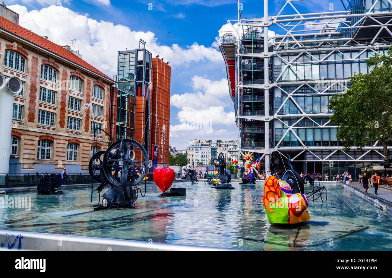 Paris, France - June 04, 2018: Stravinsky fountain with background centre Pompidou. This is a fountain featuring 16 sculptures. Stock Photo
