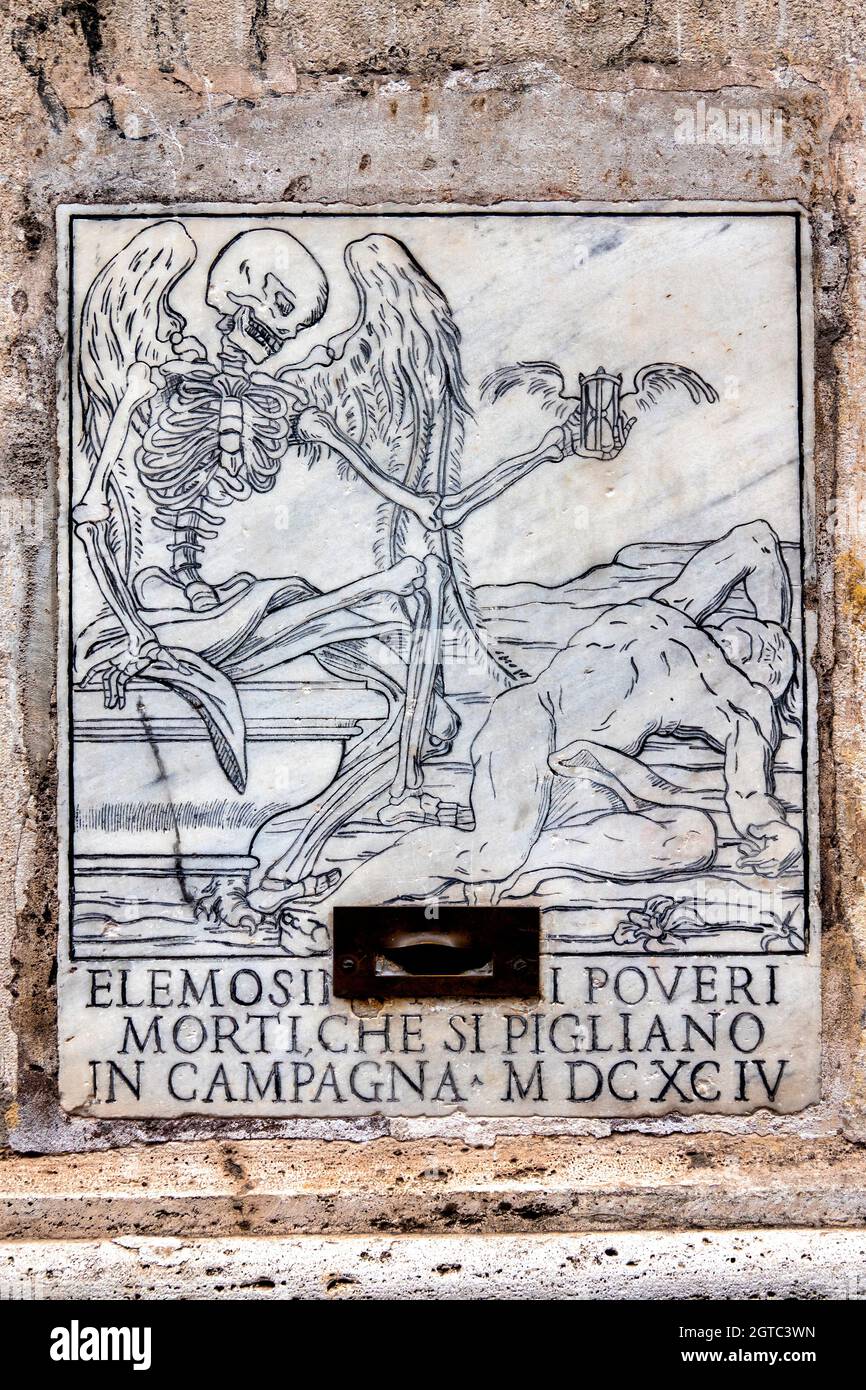 Marble plaque for the collection of alms for the deceased in Santa Maria dell'Orazione e Morte, Rome Italy Stock Photo