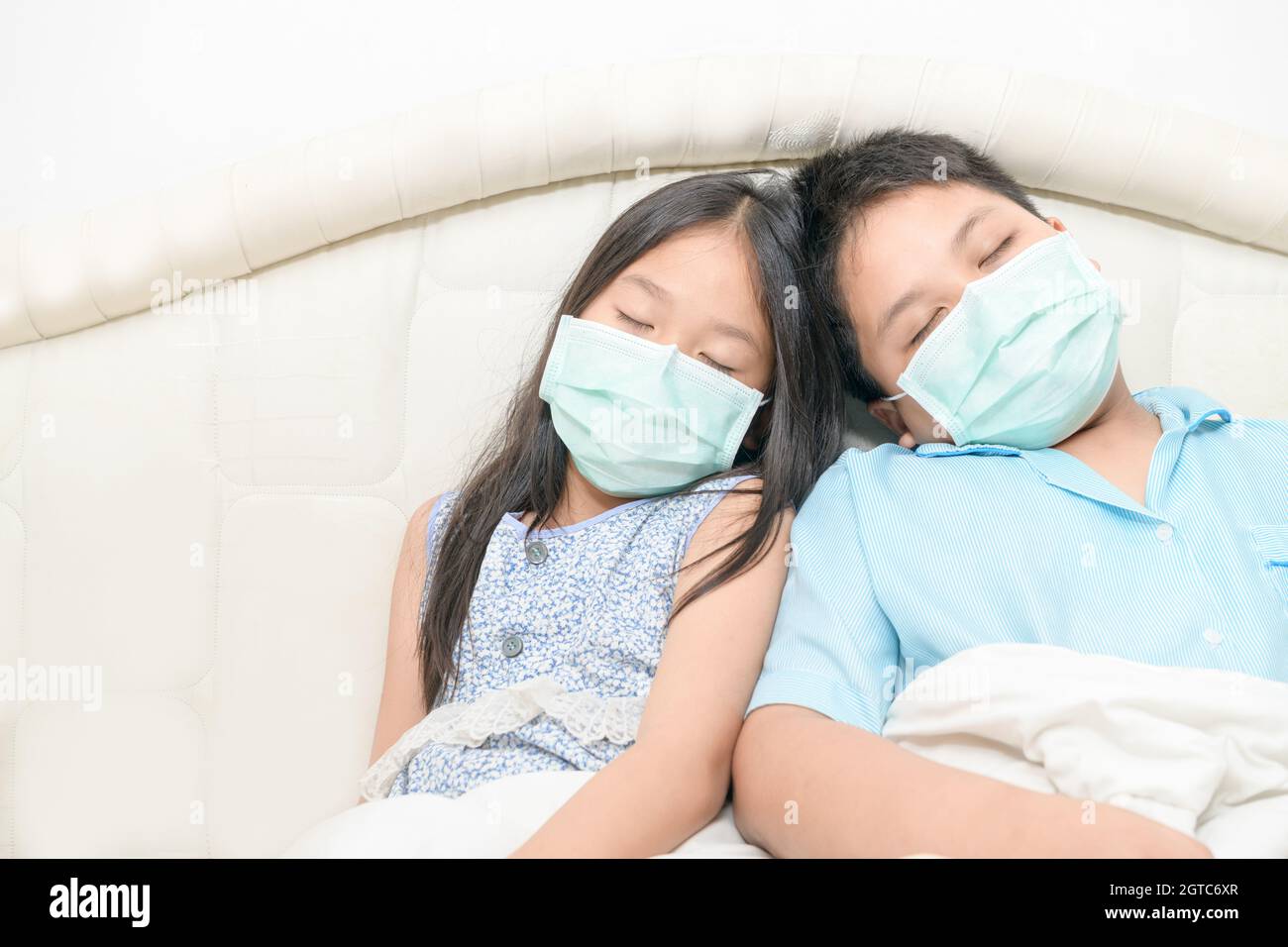 Brother And Sister Wear Surgical Mask Sleep On Bed, Sick Child With
