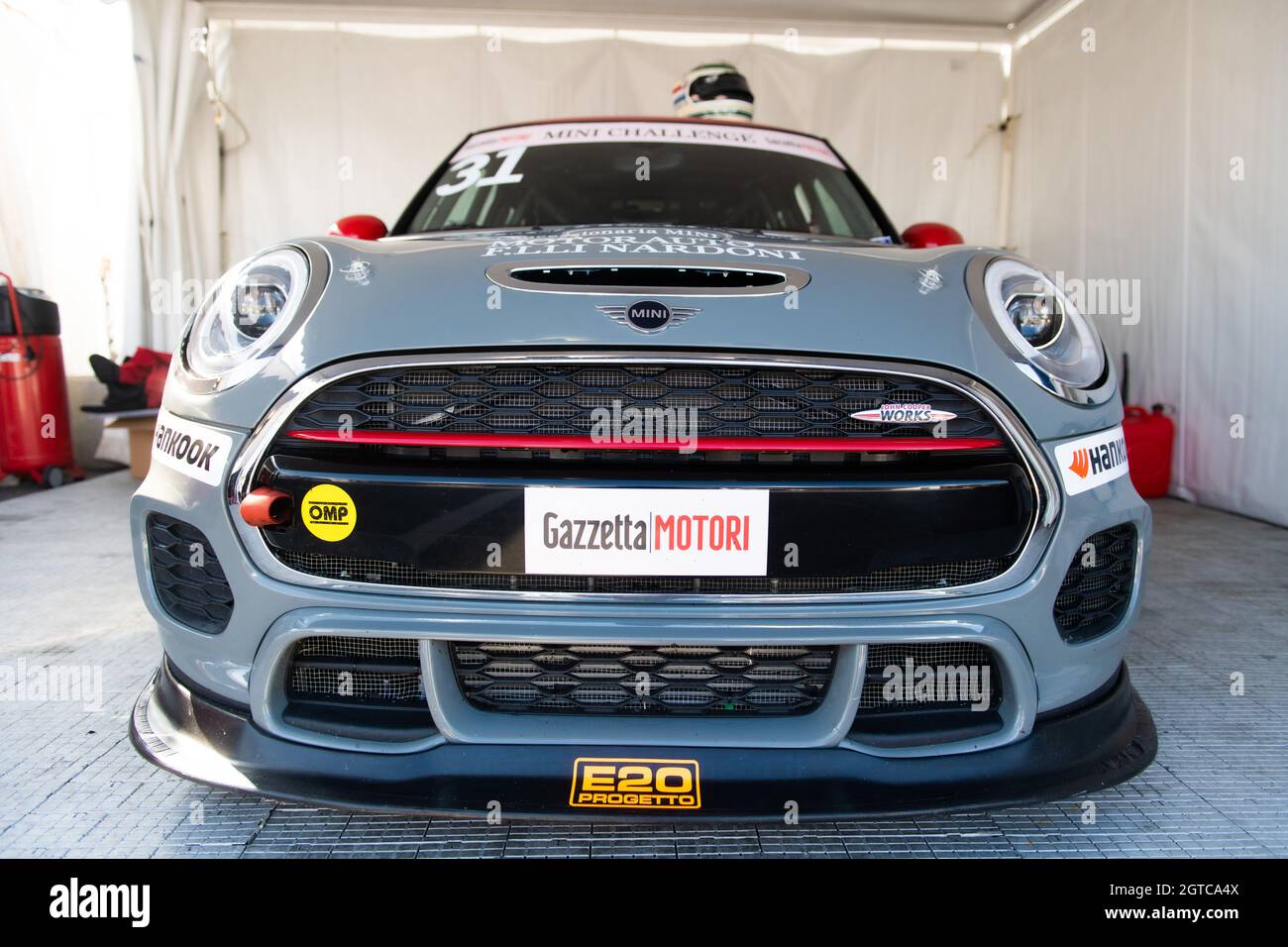 Vallelunga, italy september 18th 2021 Aci racing weekend. Mini Cooper race car competition standing in motorsport showroom no people low angle view Stock Photo