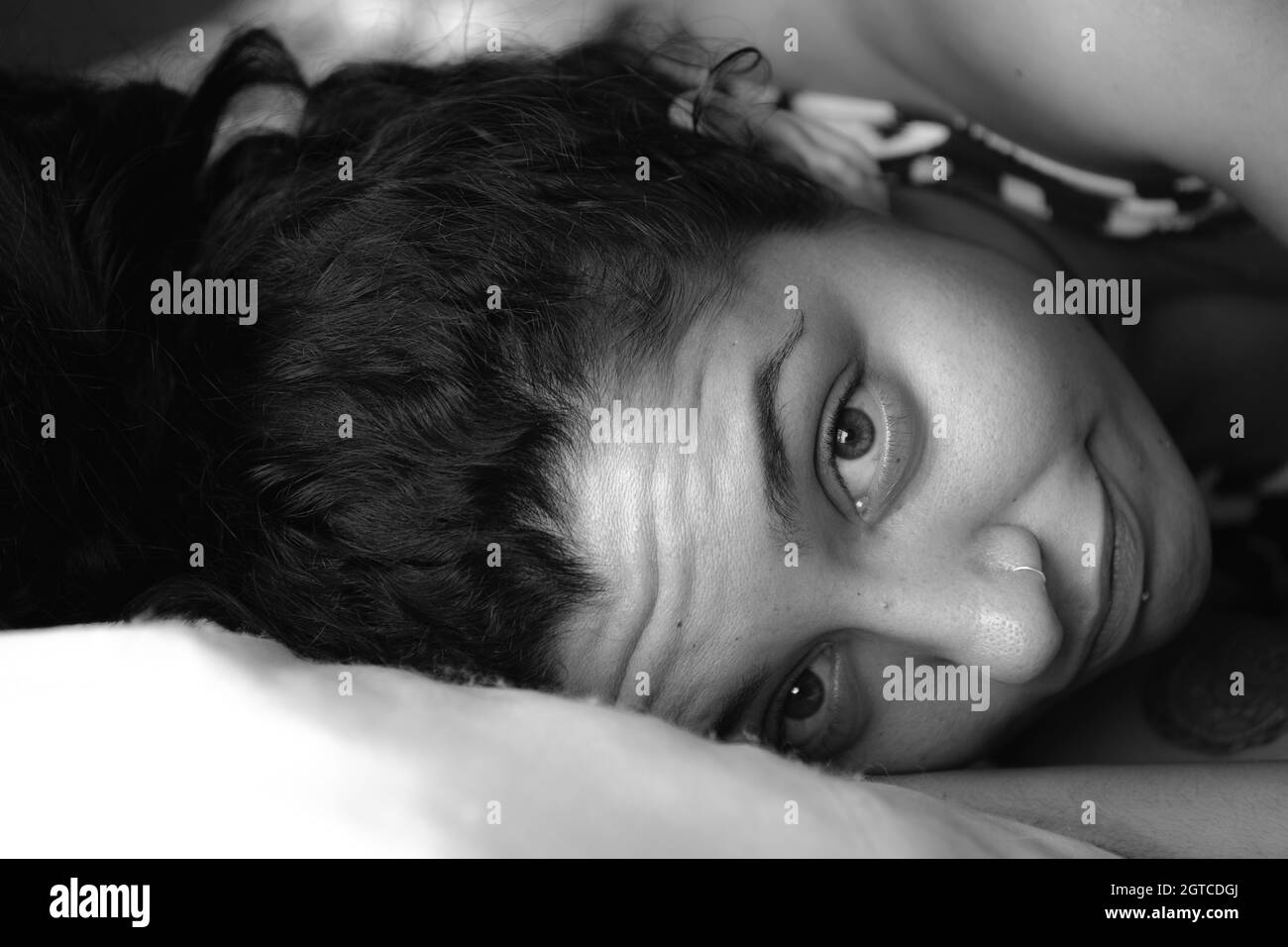 Women lying down bed Black and White Stock Photos & Images - Alamy