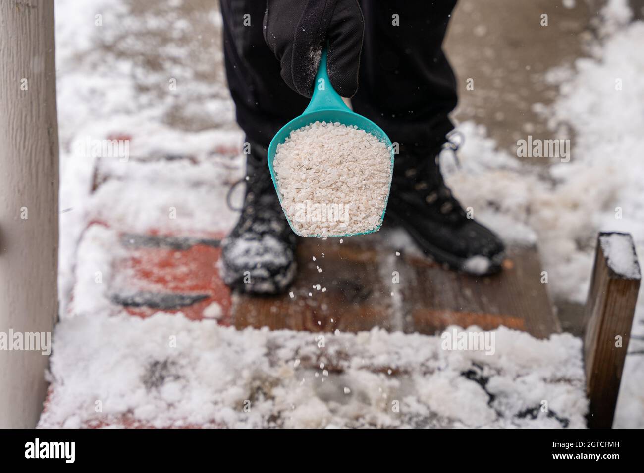 Rock Salt Ice Melt Is Being Spread On Your Walkway To Melt The Ice And