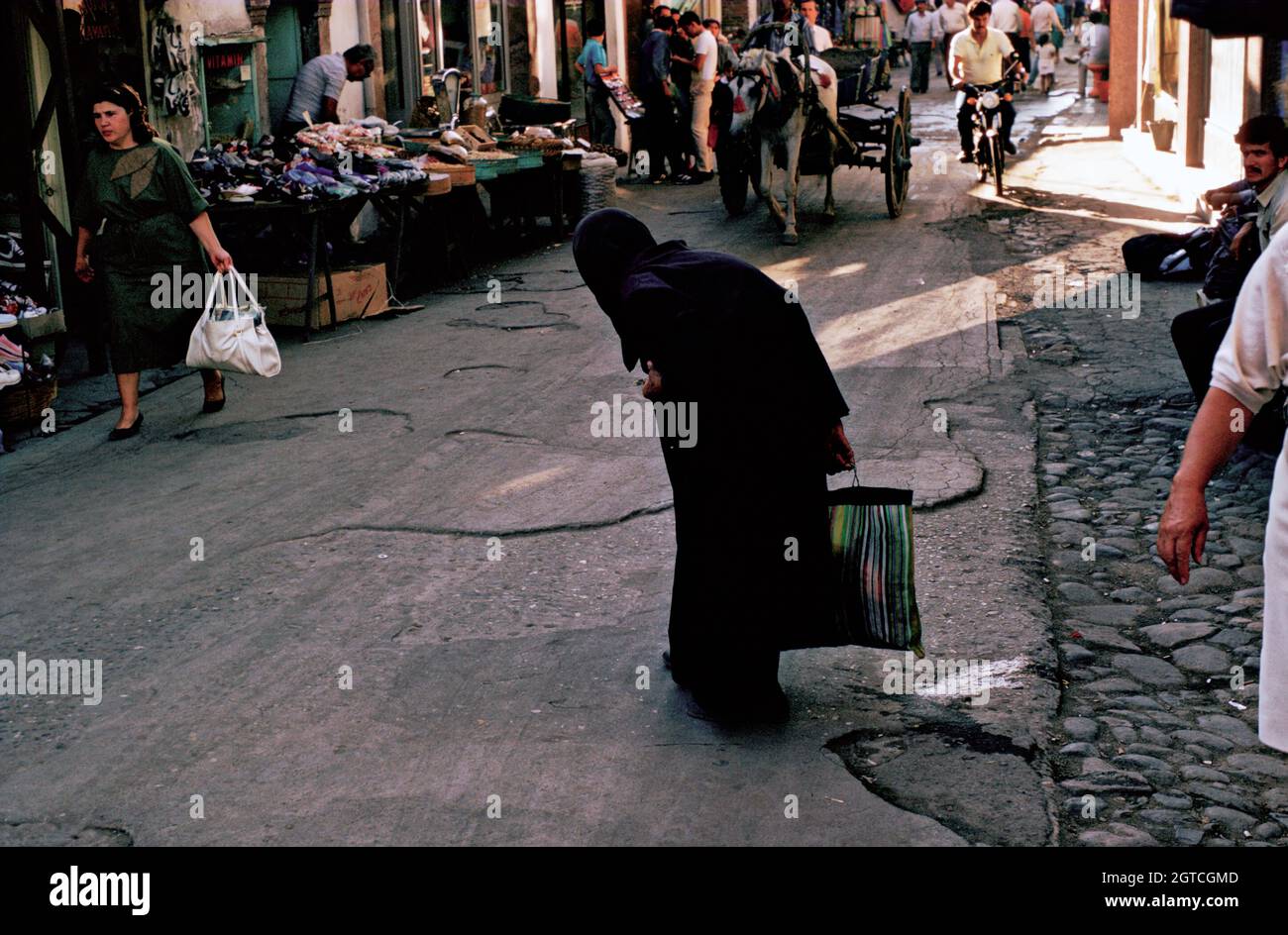 Old woman crossing street in hi-res stock photography and images - Alamy