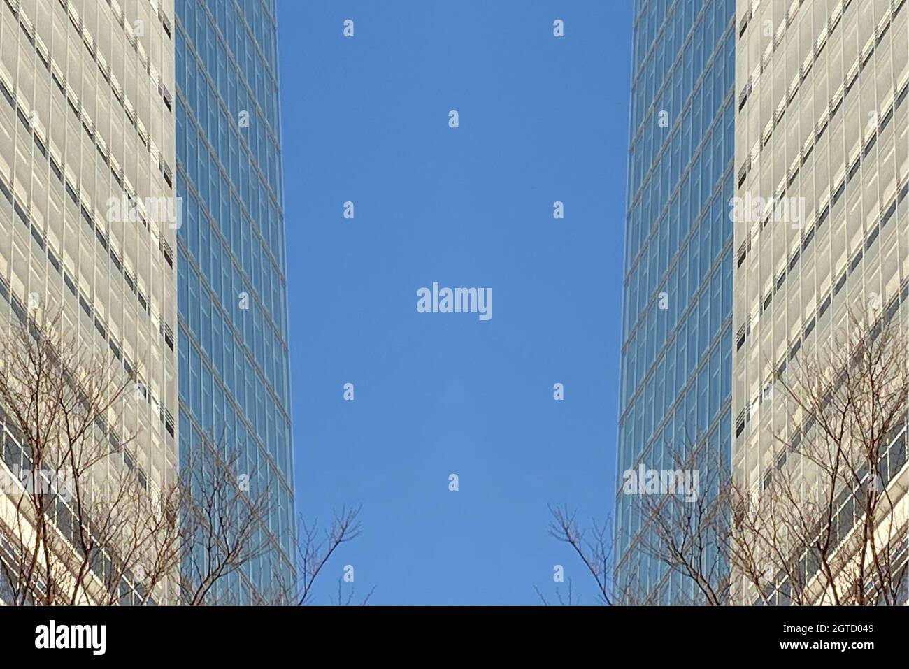 Tall office building in blue sky background Stock Photo - Alamy