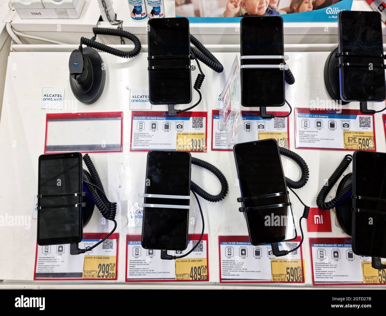 Auchan supermarket, Poland, lots of smartphones, mobile phones, devices on  the store display, Polish prices, table top view, nobody. Consumer electron  Stock Photo - Alamy