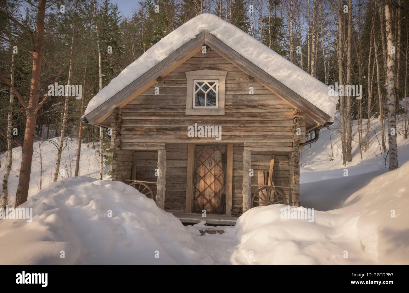 abandoned house in an winter forest landscape Stock Photo