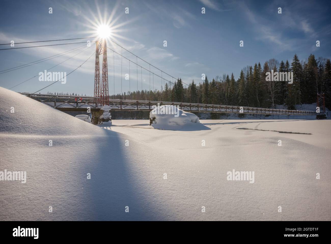 hang bridge with sun flares in the winter Stock Photo