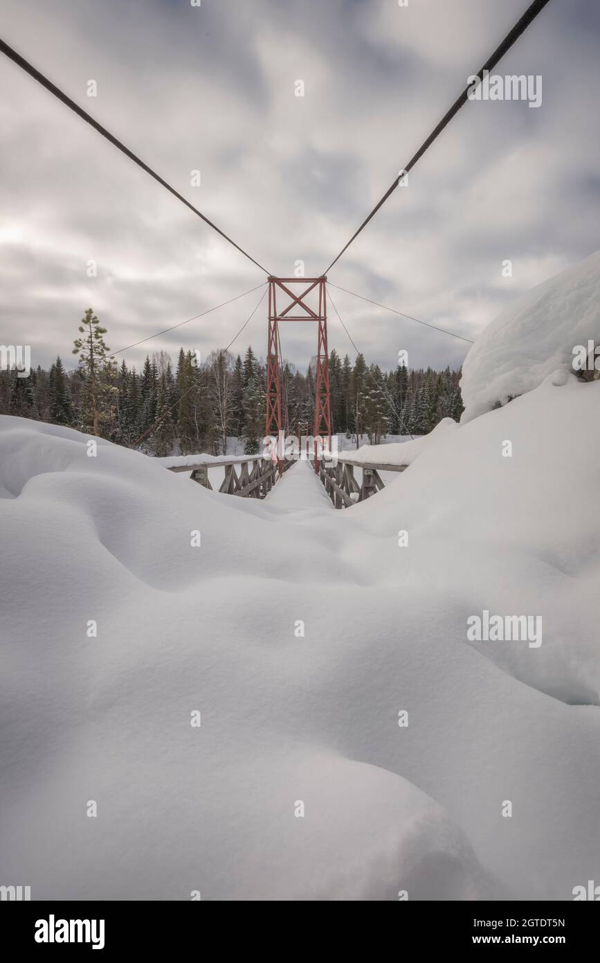 hang bridge with snow in the winter Stock Photo