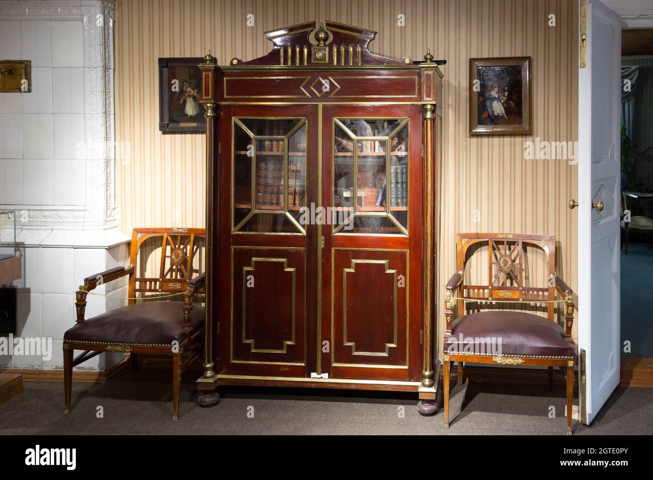 Irkutsk, Russia - July 27, 2021 Russian Museum of the 18th century.  Editorial. Wardrobe and two armchairs against the wall Stock Photo - Alamy
