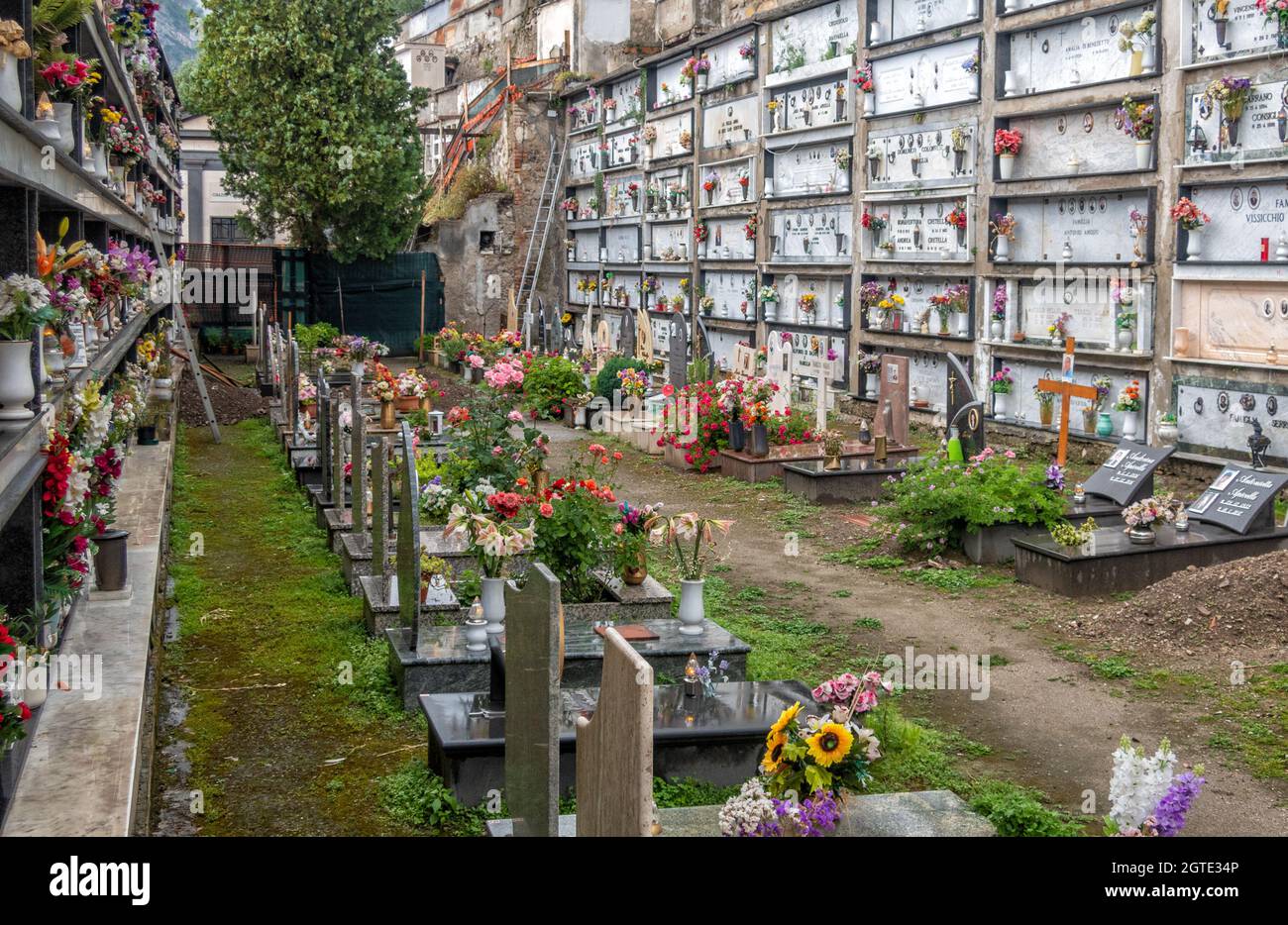 View of the famous hillside cemetery with graves and crypts, decorated with bouquets of flowers, on the Amalfi coast,Campania, Italy Stock Photo