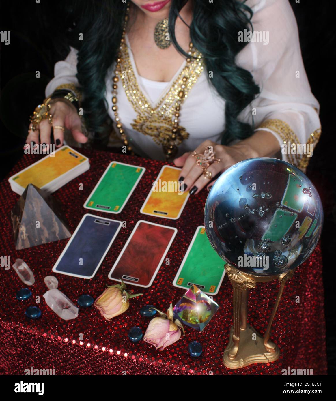 Female Psychic with crystal ball and tarot cards, Shallow DOF Stock Photo