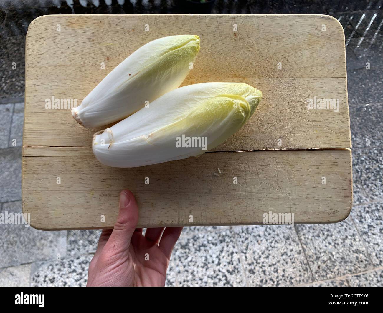High Angle View Of Fresh Chicory Vegetable On Cutting Board Stock Photo