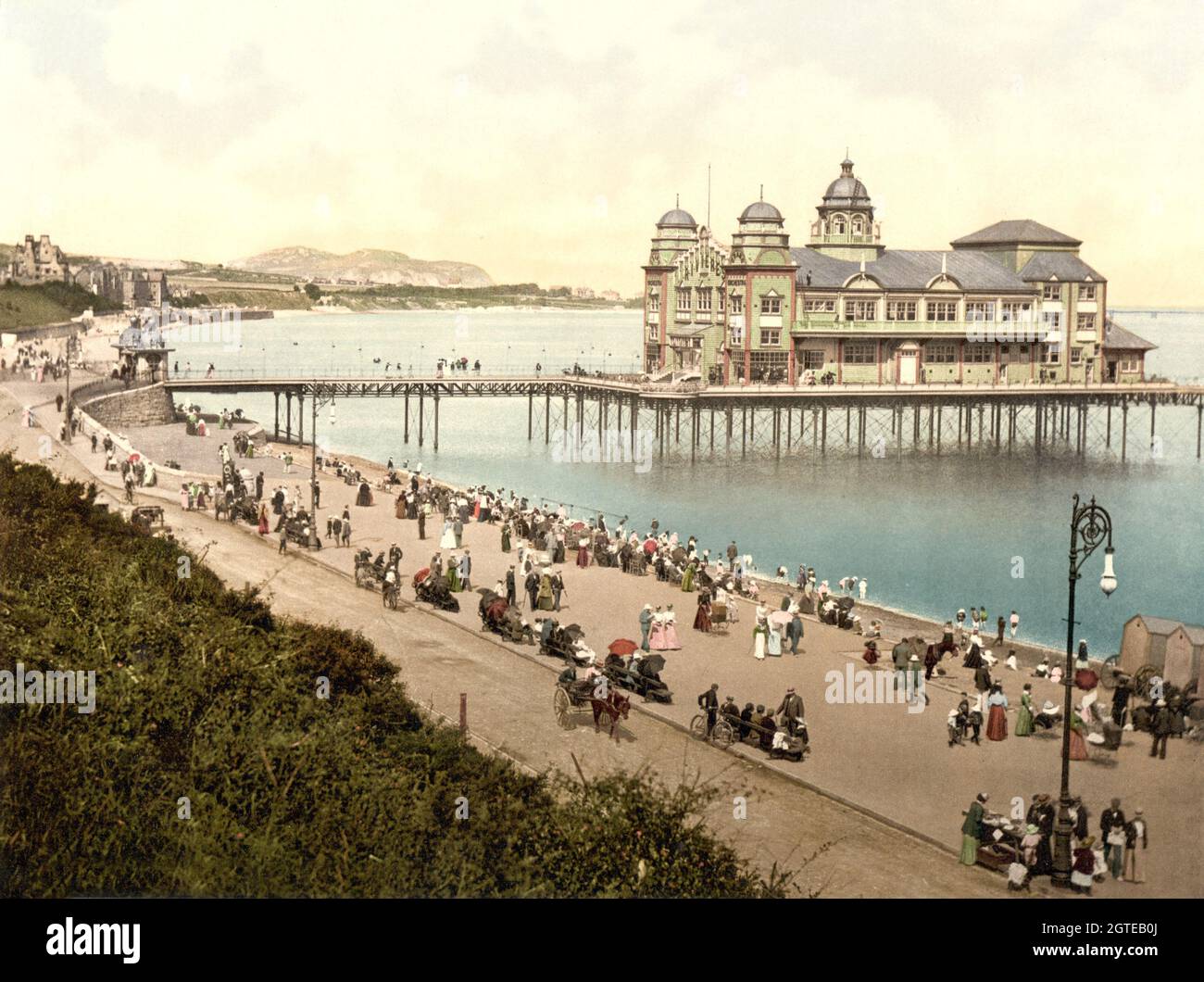 Vintage colour photo circa 1900 of the original Colwyn Bay Victoria Pier and Pavilion on the North Wales coast. The pier was opened on 1 June 1900 and the pavilion was burned down in 1922 though the original cast iron structure survives to the present day. Stock Photo