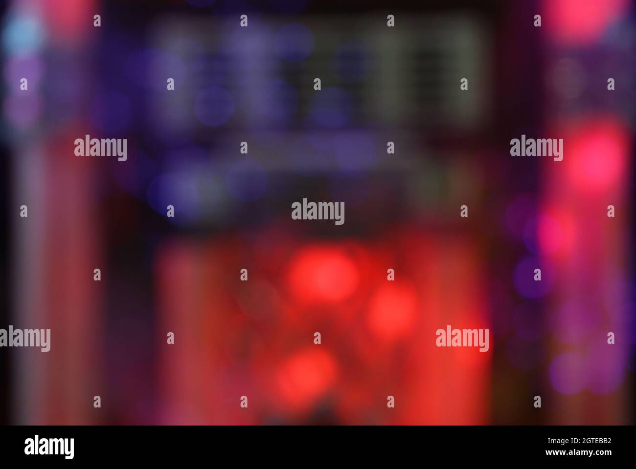 blur background jukebox in bar with lights and bokeh Stock Photo