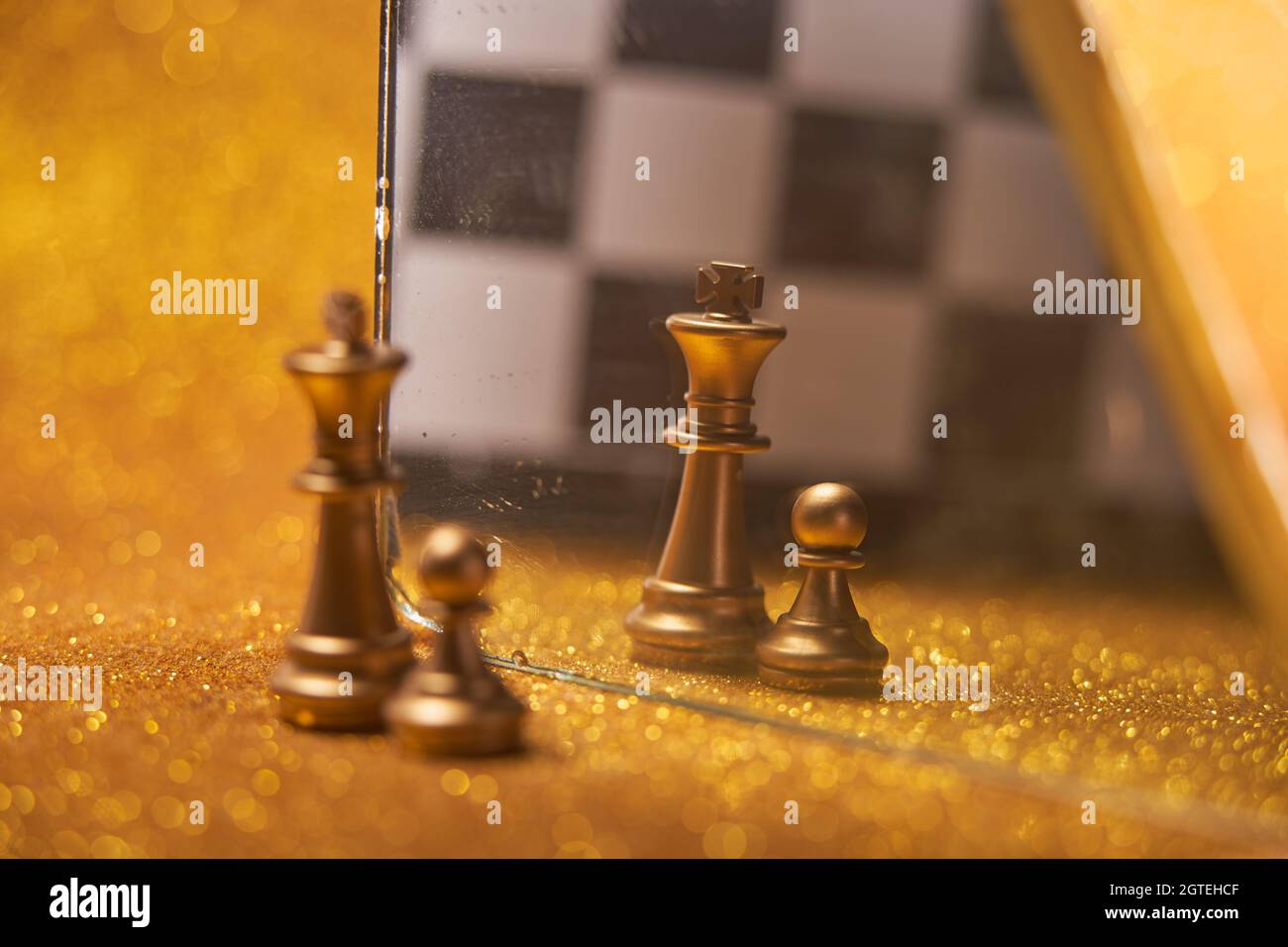Chess Pieces King And Pawn And Their Reflection In The Mirror Stock