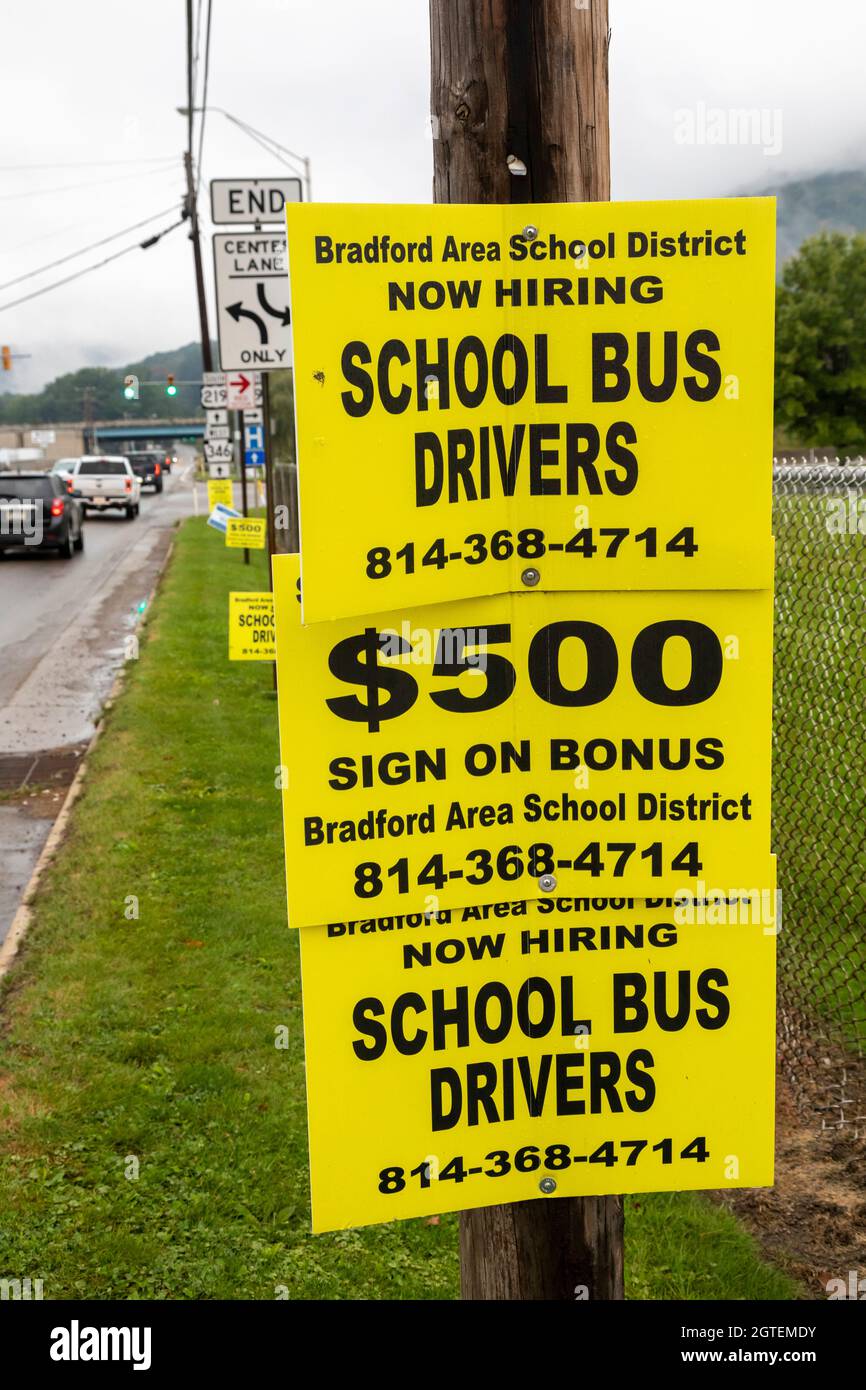 Bradford, Pennsylvania - Posters on a telephone pole advertise that the Bradford Area School District wants to hire school bus drivers. It offers a $5 Stock Photo