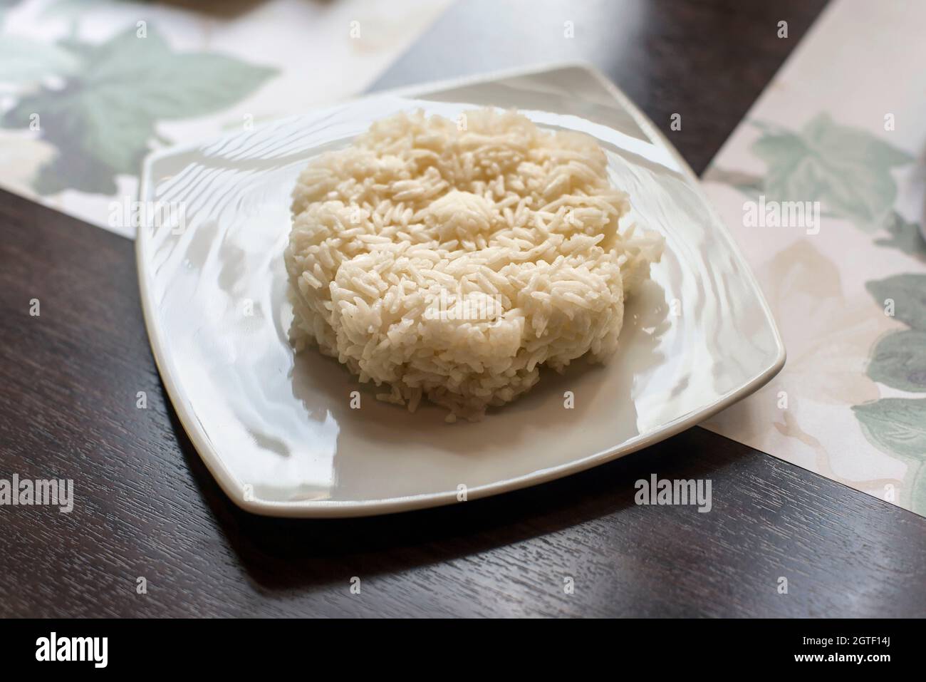 High Angle View Of Steamed Rice In Plate On Table Stock Photo