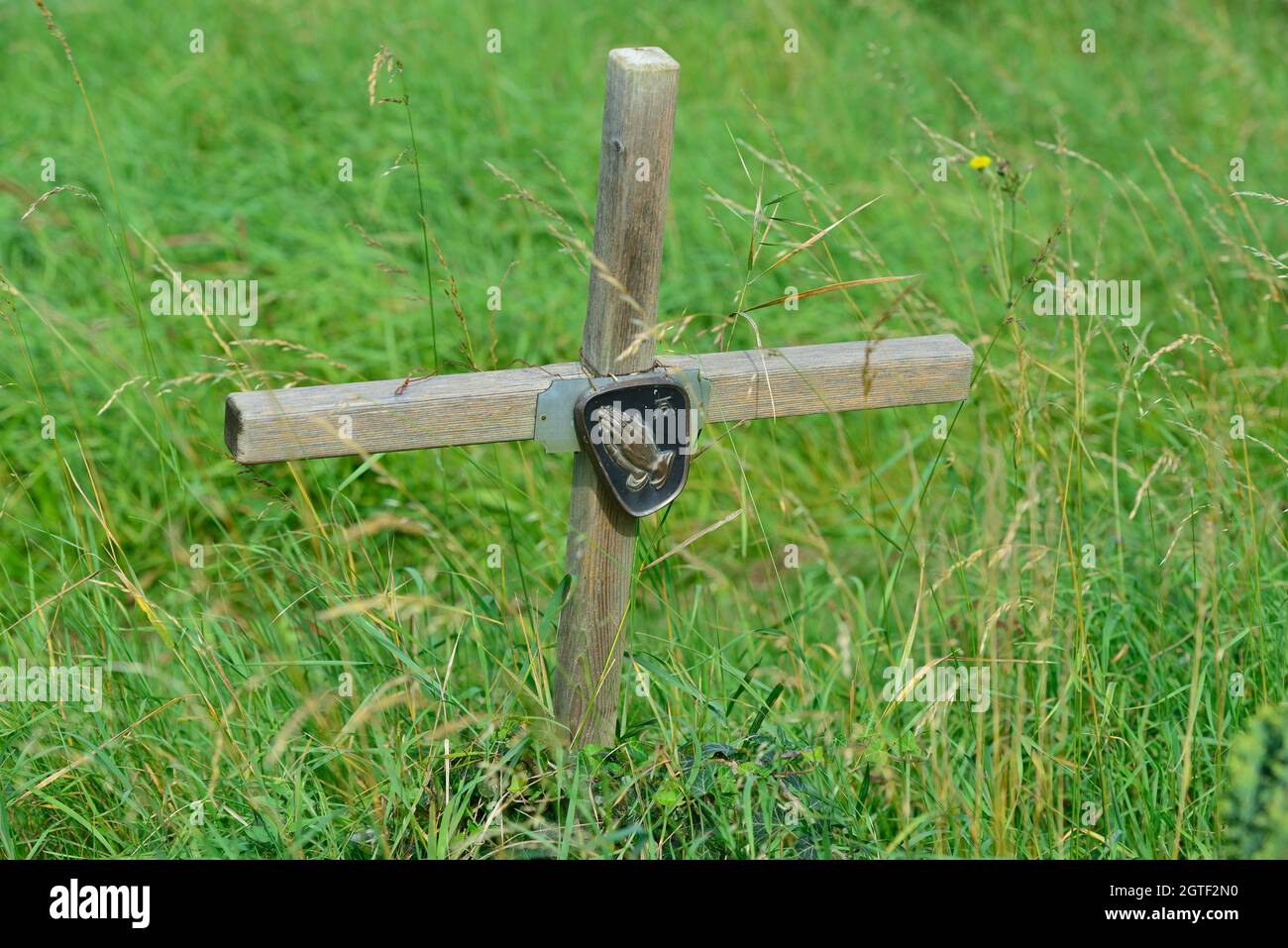 Vienna, Austria. The Vienna Central Cemetery. Wooden cross with folded hands Stock Photo