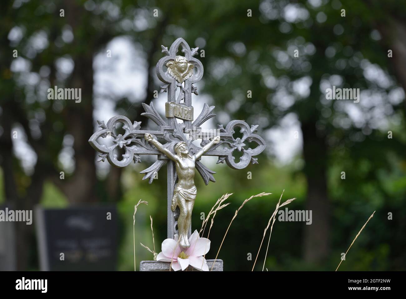 Vienna, Austria. The Vienna Central Cemetery. Metal cross with Jesus figure at the central cemetery Stock Photo