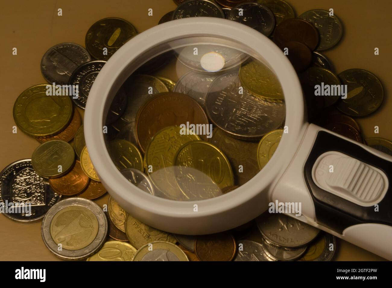 Coin collection with a magnifying glass hi-res stock photography and images  - Alamy