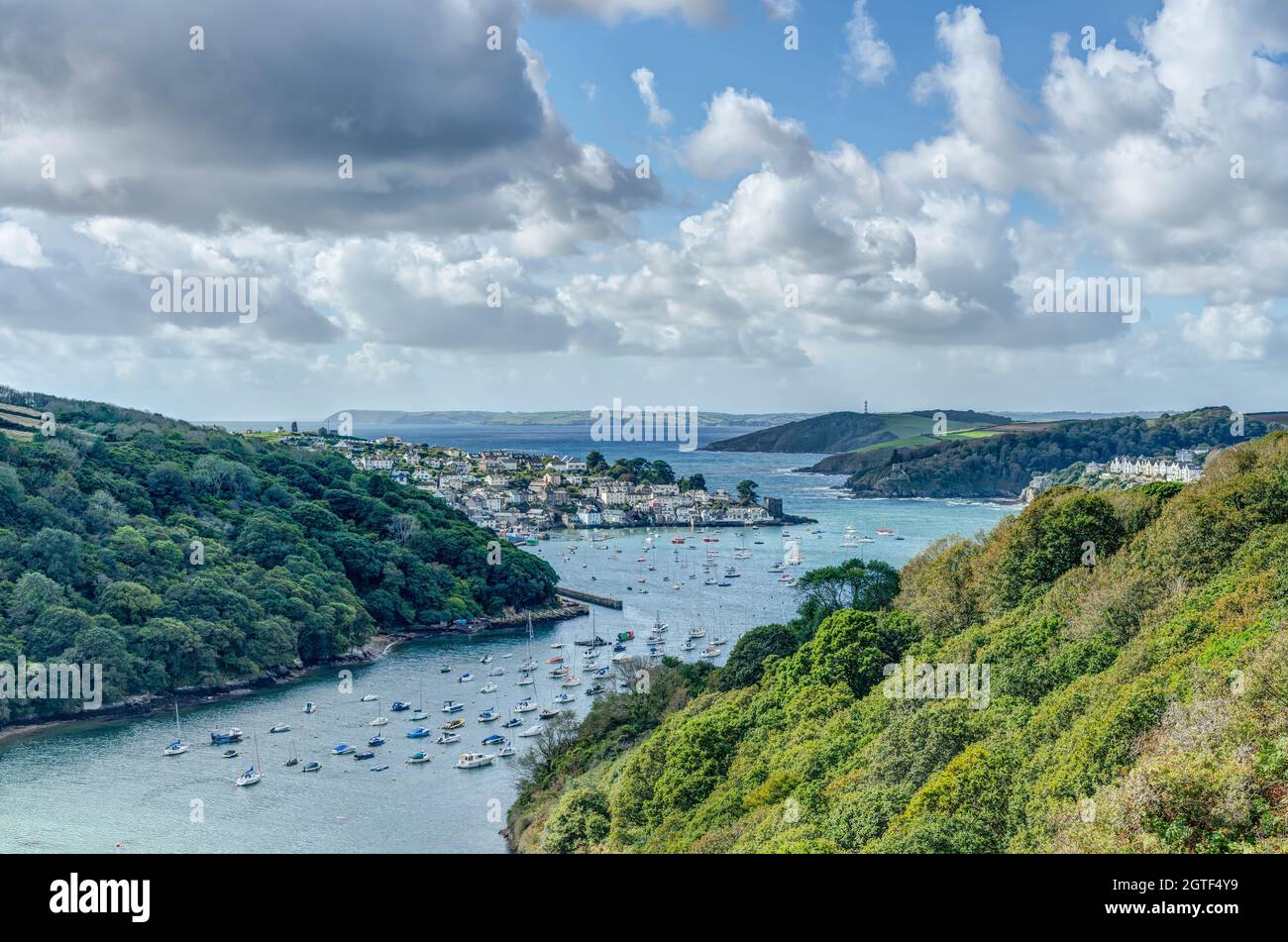 Spectacular coastal view from the Hall Walk in summer overlooking the Fowey Estuary with far reaching views to Polruan, Menabilly and St Austell Bay. Stock Photo