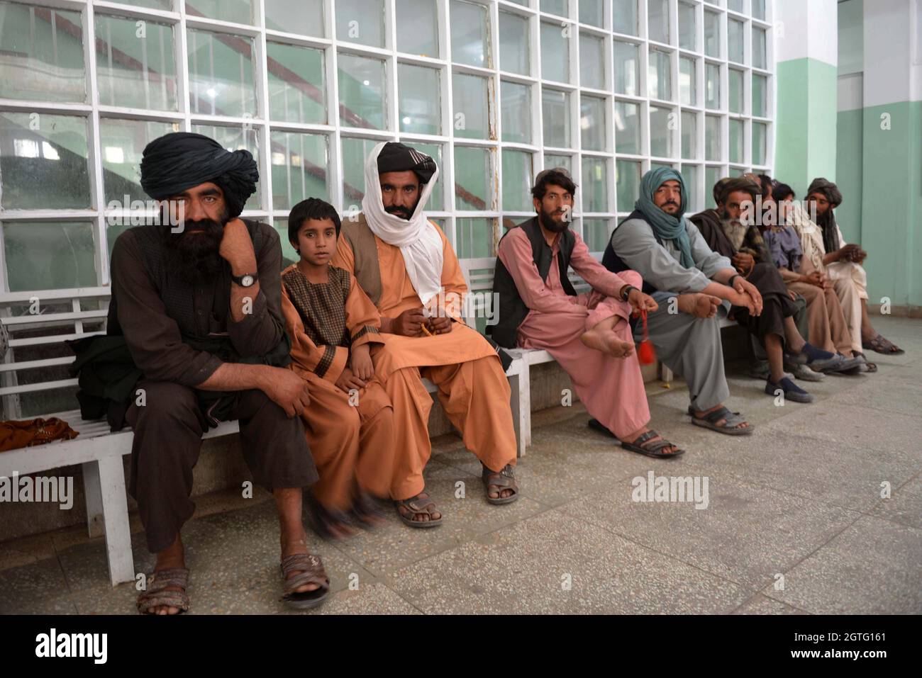 Kandahar, Afghanistan. 30th Sep, 2021. Relatives of patients wait at the Mirwais Regional Hospital in Kandahar city, southern Afghanistan, Sept. 30, 2021. TO GO WITH 'Feature: China-built hospital gives patients hope amid Afghanistan's strained health system' Credit: Sanaullah Seiam/Xinhua/Alamy Live News Stock Photo