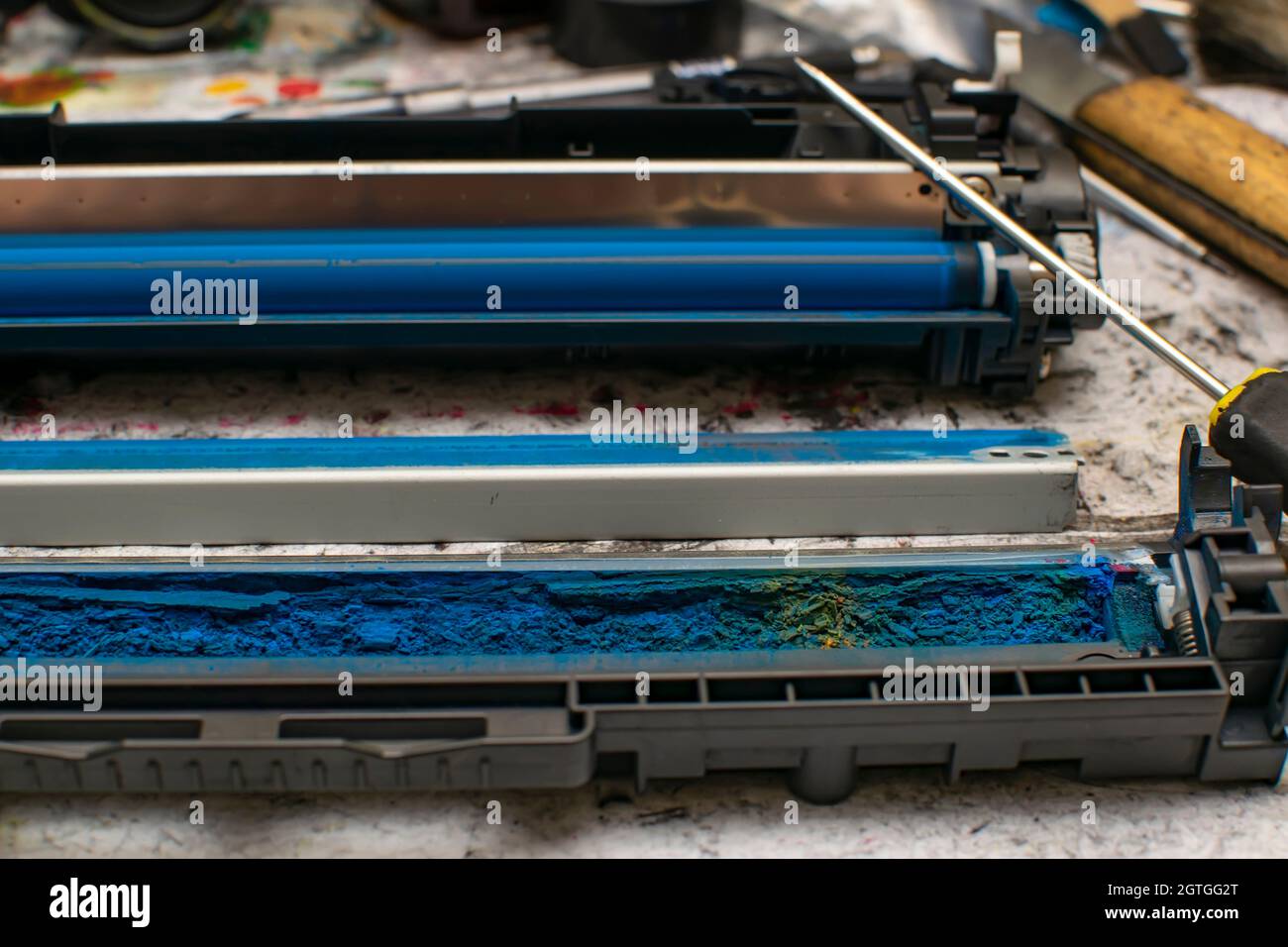view of colored toner in the hopper of the blue laser printer cartridge