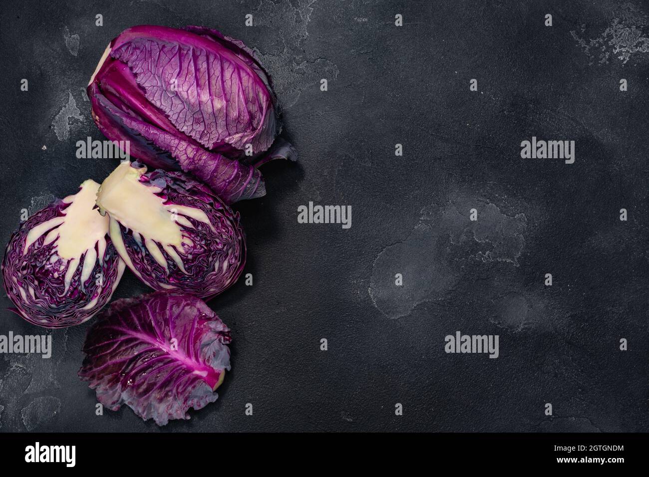 Red cabbage, anthocyanin-rich atop dark background, top view, copy space Stock Photo