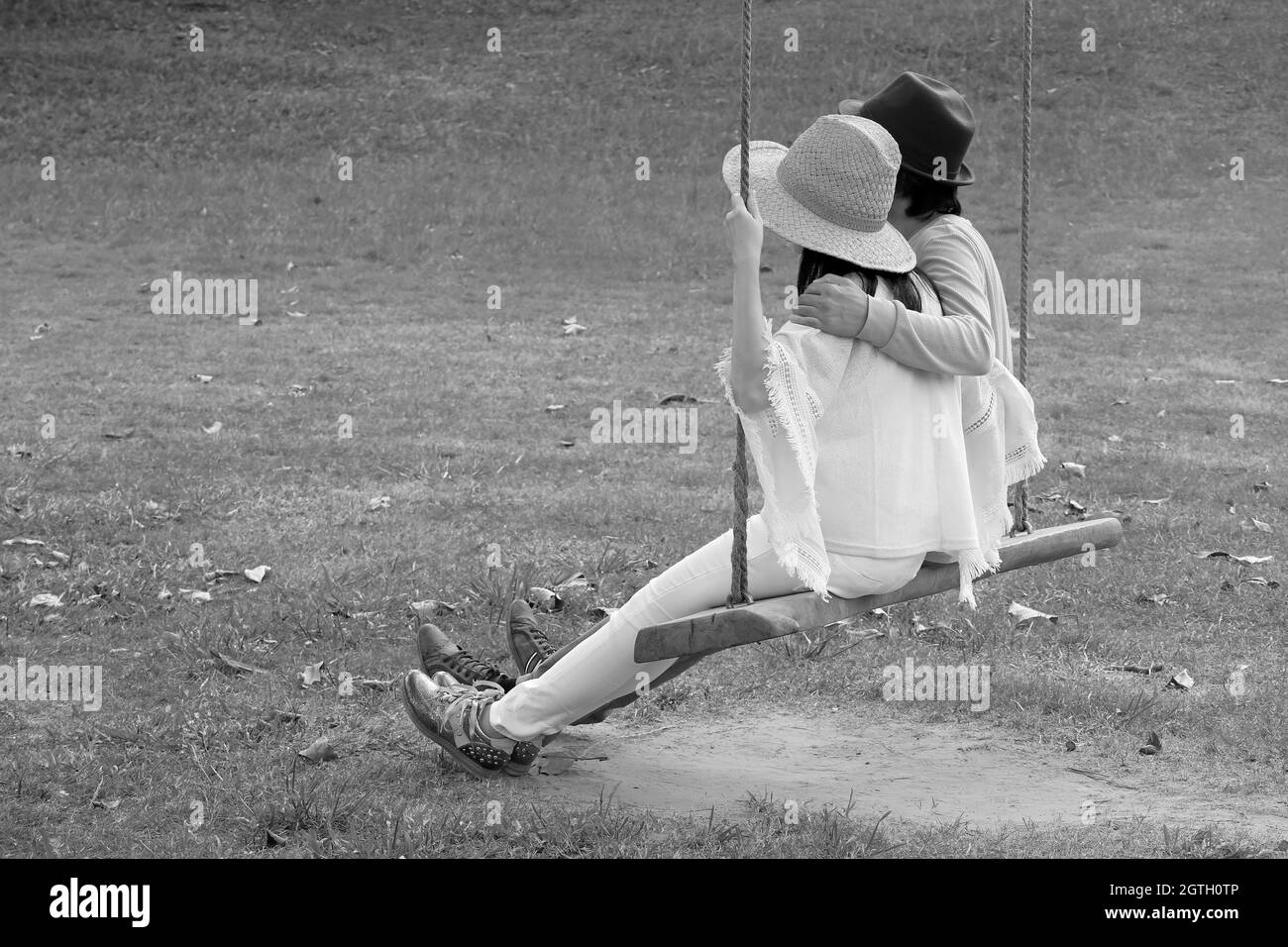 Black and white woman on swing hi-res stock photography and images - Alamy