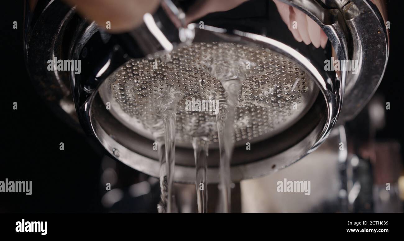 rinsing coffee machine before pouring coffee, wide photo Stock Photo