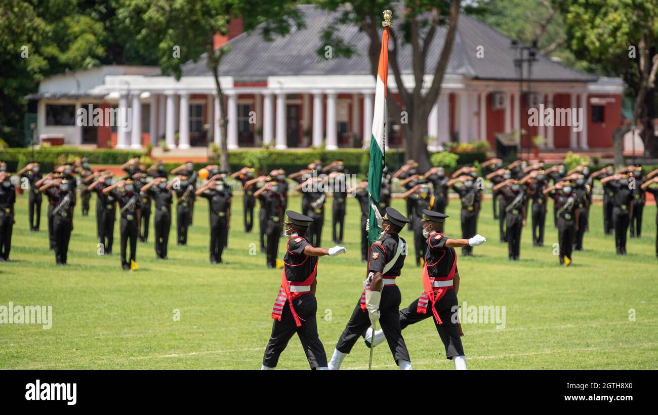 Dehradun, Uttarakhand India August 15, 2021. Indian flag at hands of young army officers at the march past in Indian Military Academy IMA.  Stock Photo