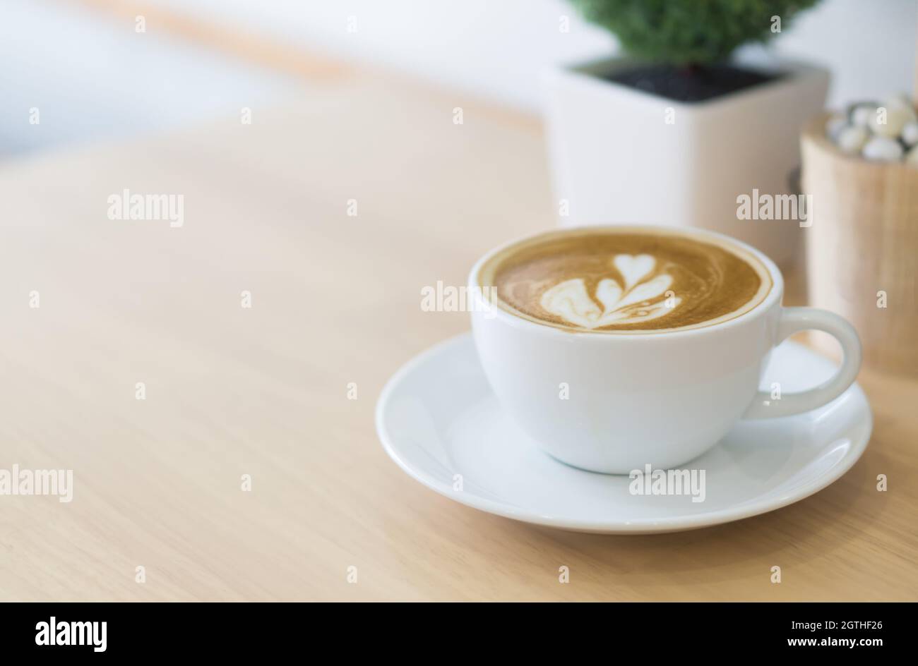 High Angle View Of Cappuccino On Wooden Table Stock Photo
