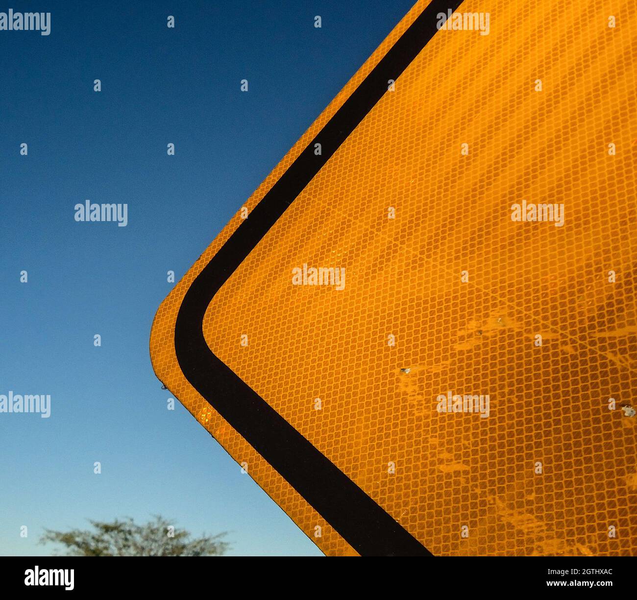 Partial View Of A Yellow Traffic Sign Near A Highway Stock Photo Alamy
