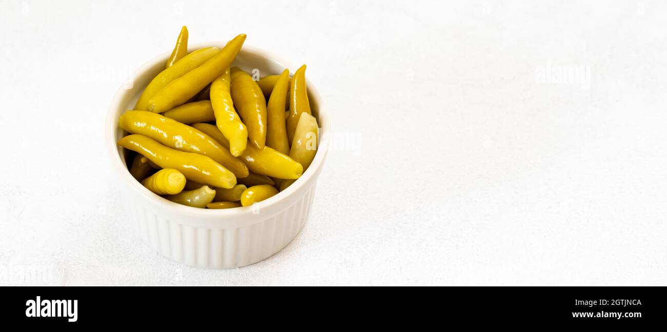Green chilli pepper pickled on a white background Stock Photo Alamy
