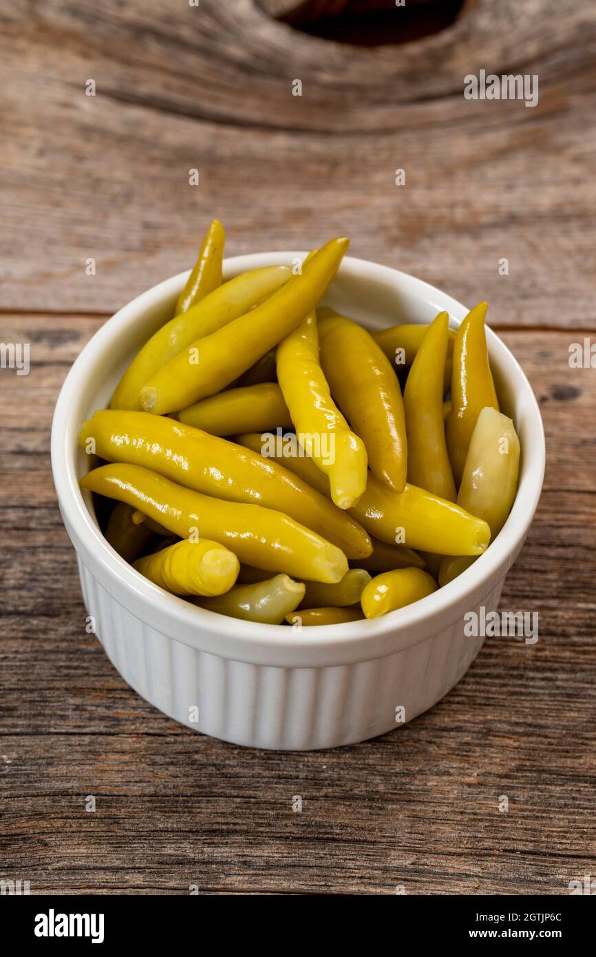 Green chilli pepper pickled on wooden background Stock Photo Alamy