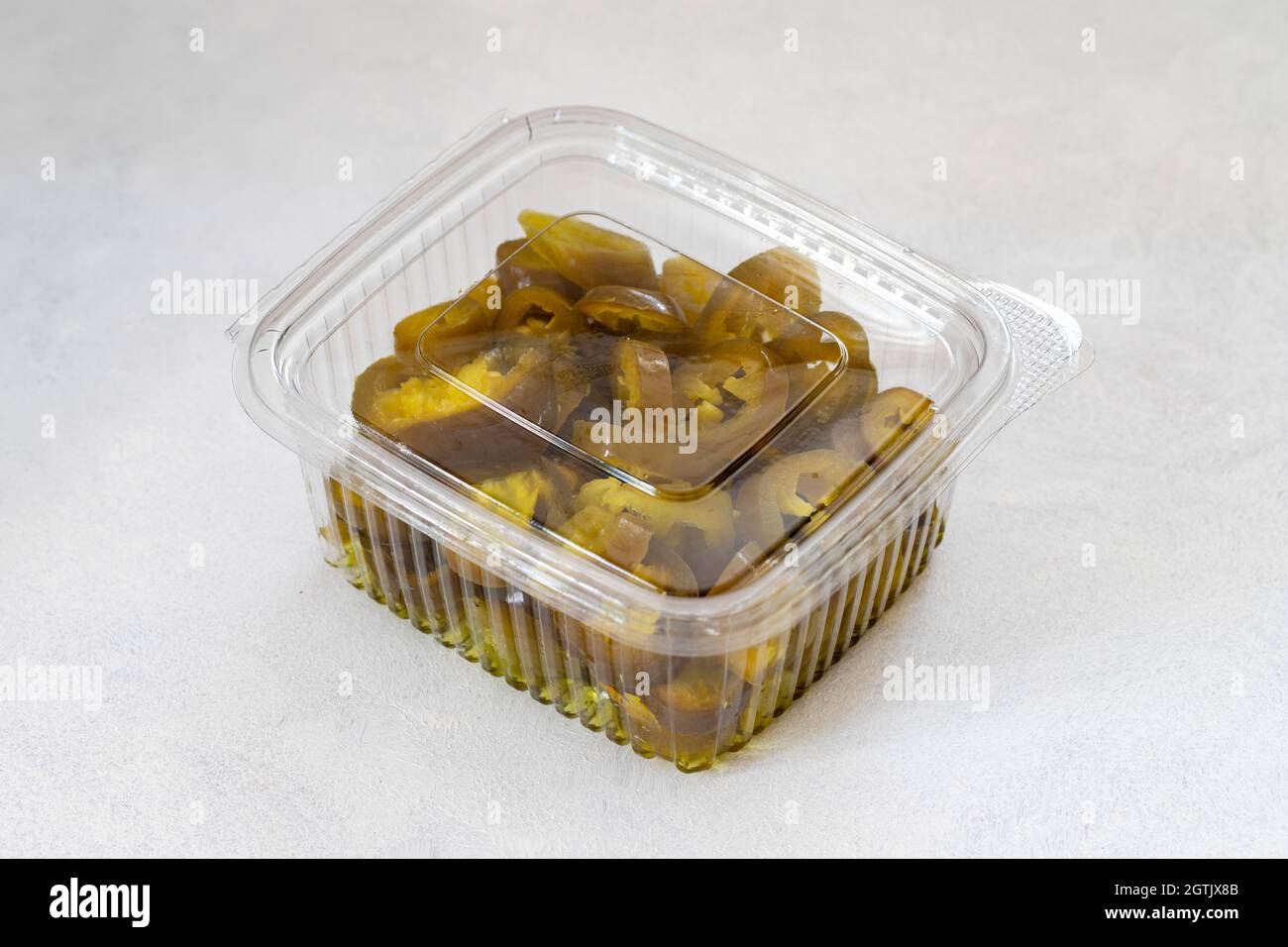 Packed pickled sliced green jalapeno peppers Stock Photo Alamy
