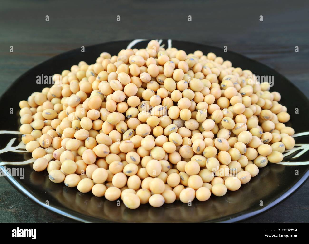 Pile Of Dried Soybeans In A Black Plate Stock Photo Alamy