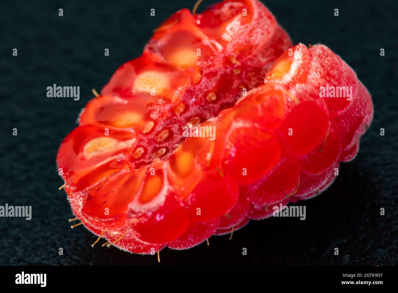 Macro Fruit: Ripe raspberry extreme close-up, black background ...