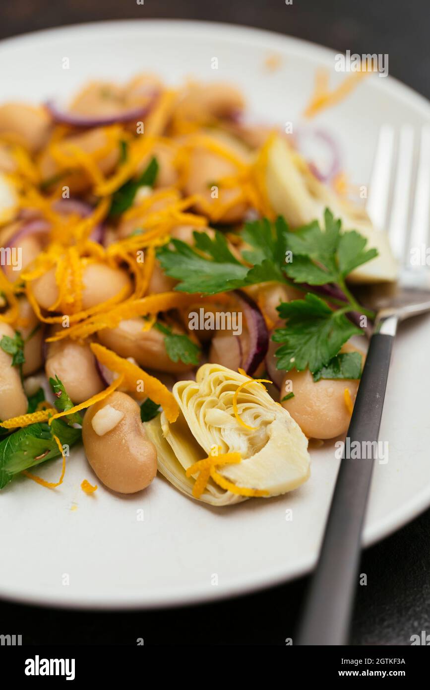 Great Northern Beans Salad with Artichoke and Orange dressing Stock Photo