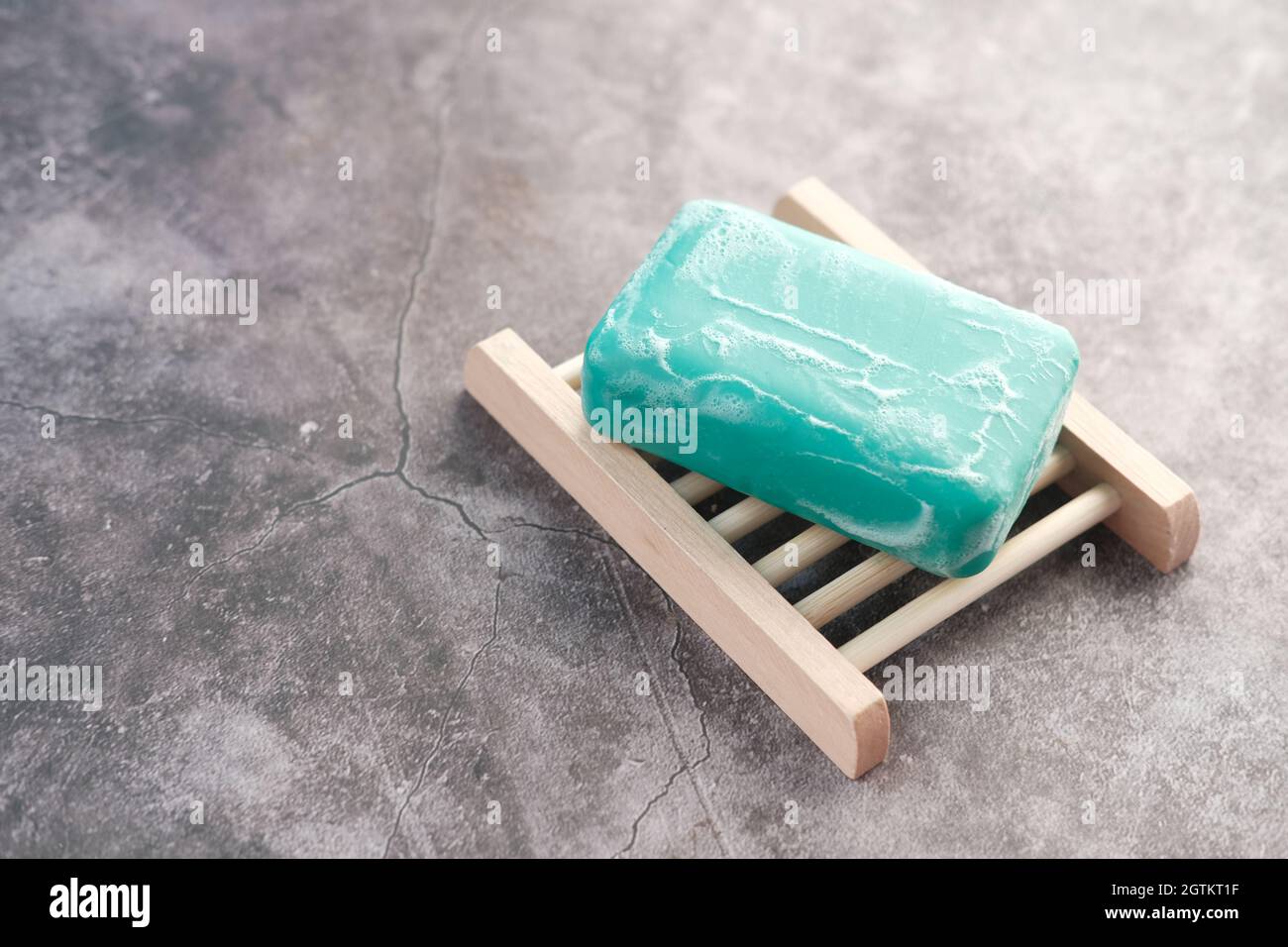 Soap and bubbles on a case on black background  Stock Photo
