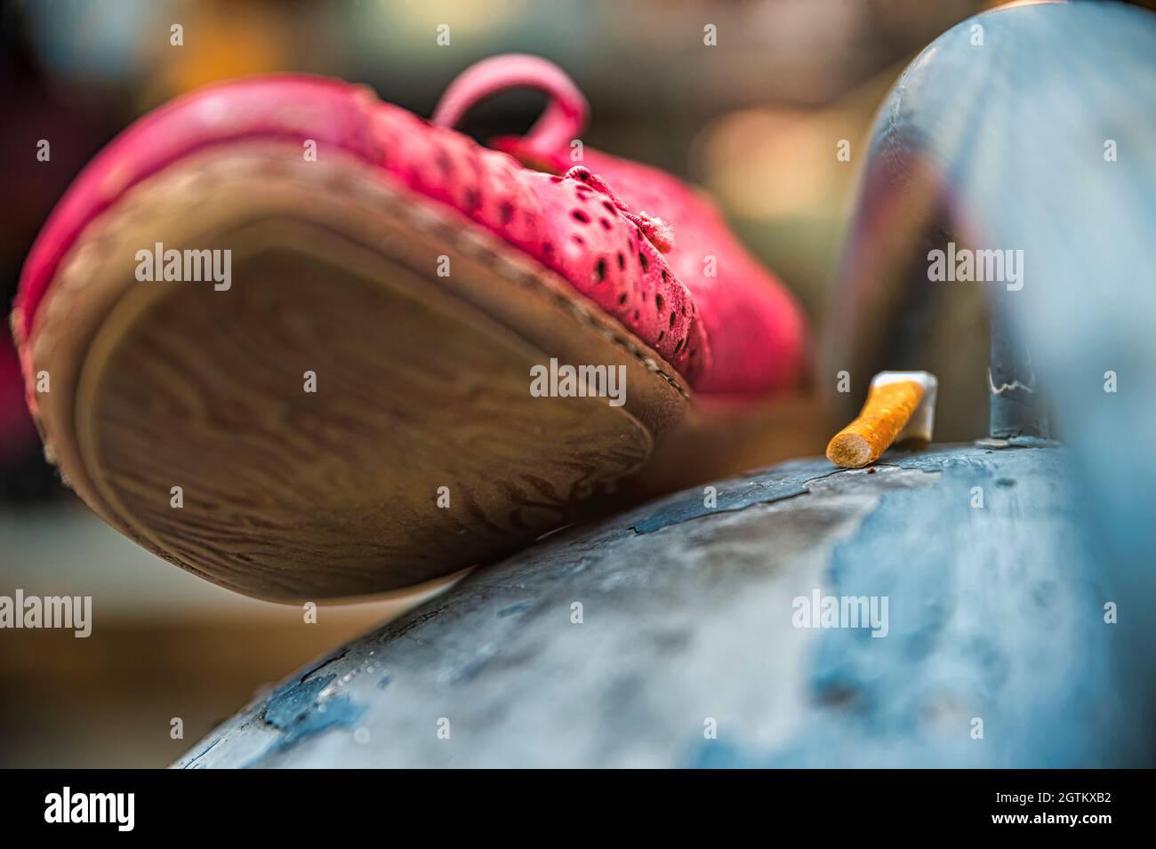 Old Shoe And Cigarette Butt On A Litter Bin Stock Photo - Alamy