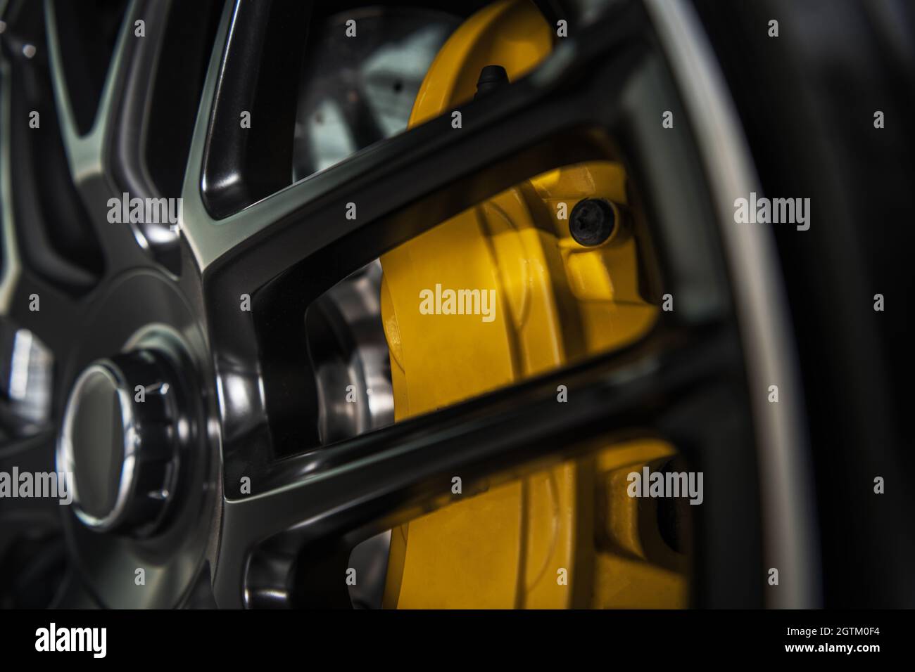 Yellow Performance Vehicle Brake Caliper Close Up. Automotive Theme. Stock Photo