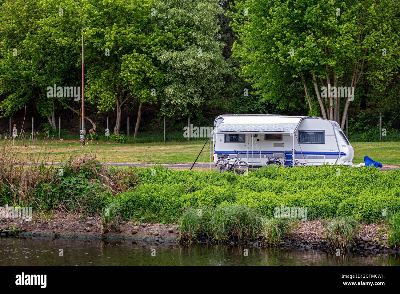 Campers By The River Stock Photo - Alamy