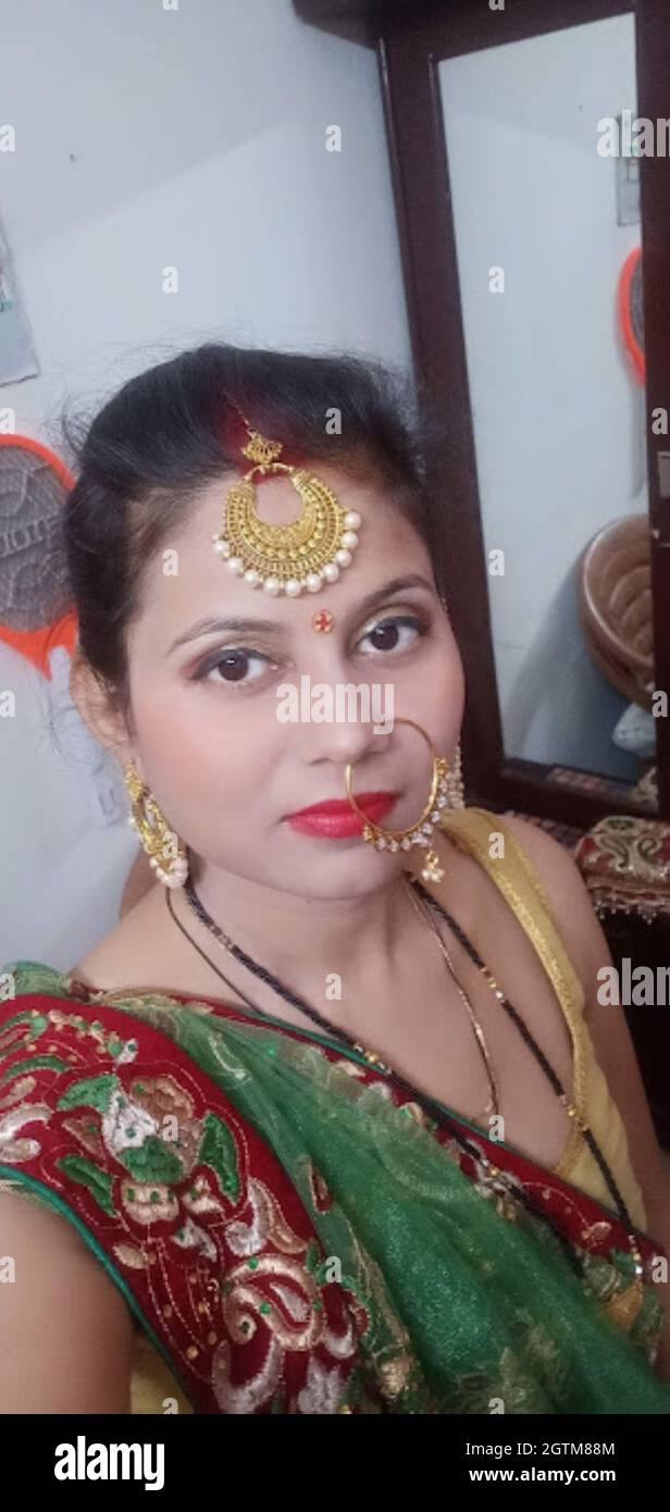 A Portrait Shot of Indian Married Woman in traditional dress during